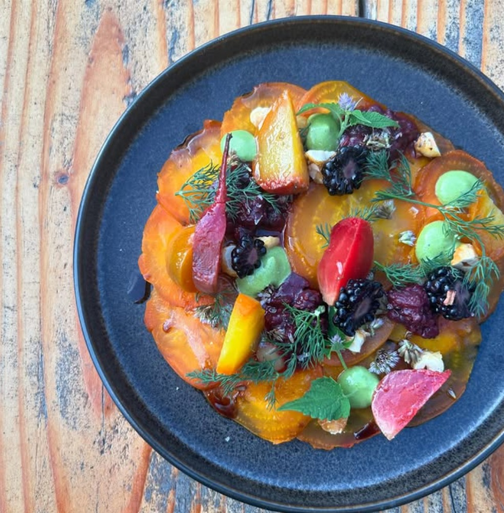 Urban Hearth colorful beet dish with vibrant garnishes and fresh herbs
