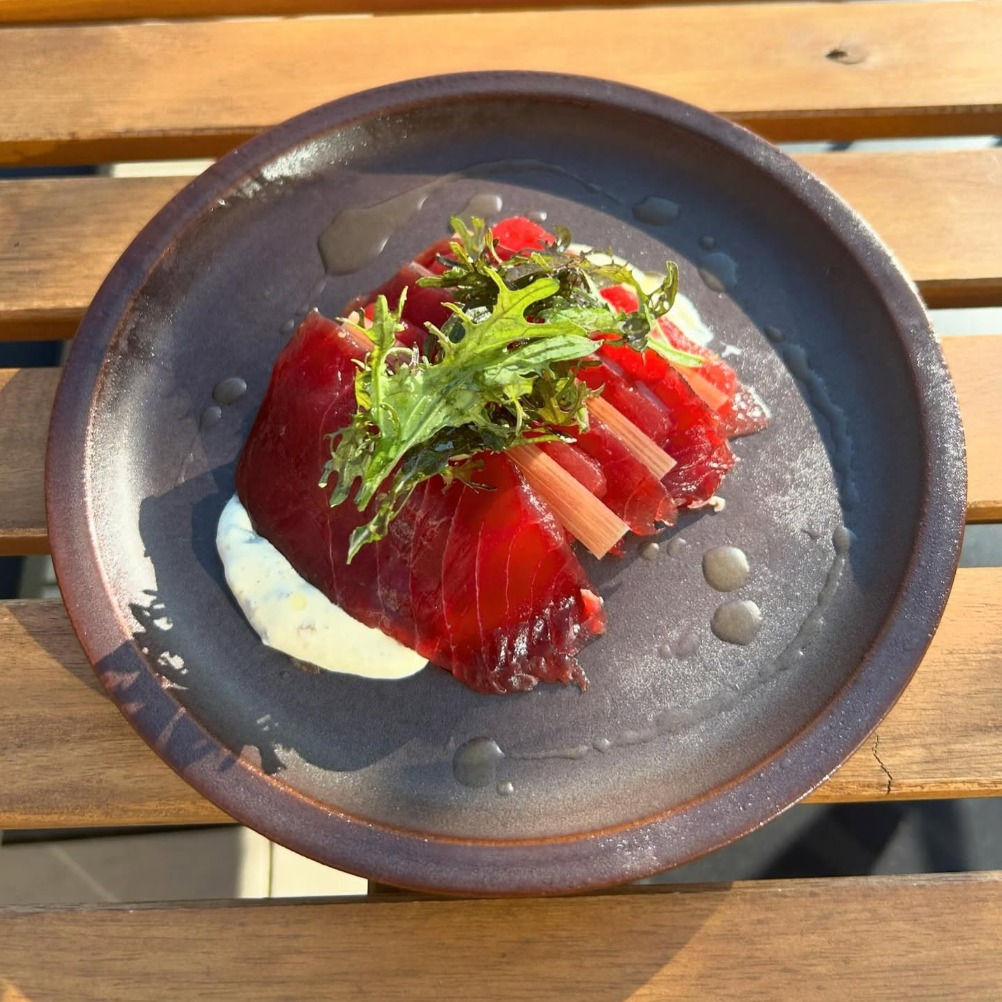 Urban Hearth signature dish with artfully plated beets and microgreens